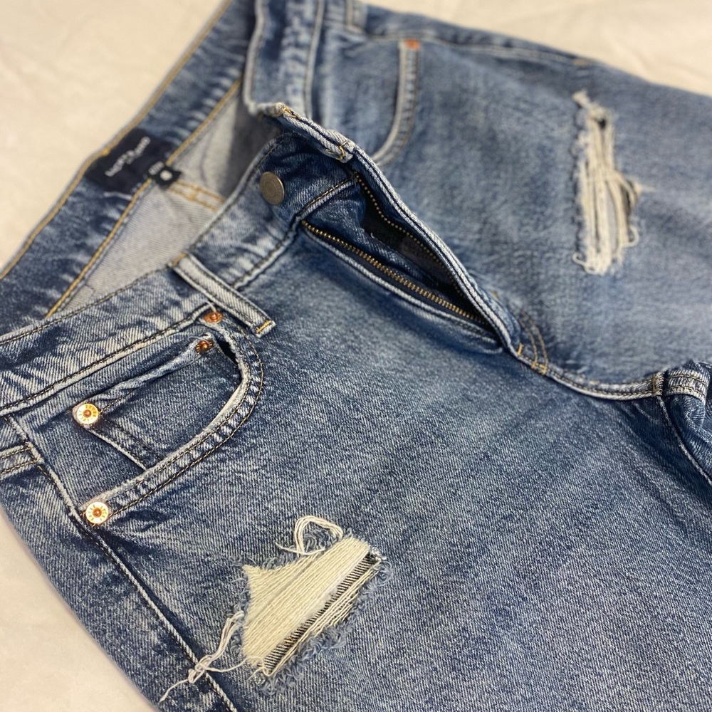 Distressed Blue Denim Jeans